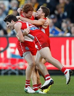 20171123_hewettpapp_p.jpg George Hewett and Tom Papley celebrate a goal against Richmond in 2017 with Gary Rohan at the MCG. - George Hewett,Tom Papley